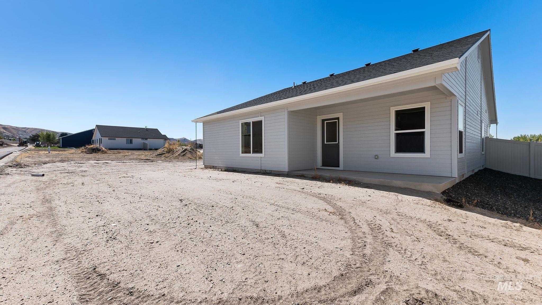1440 Castle Way Emmett, ID 83617 - Photo 20 of 30 Rear view of property featuring a patio and roof with shingles