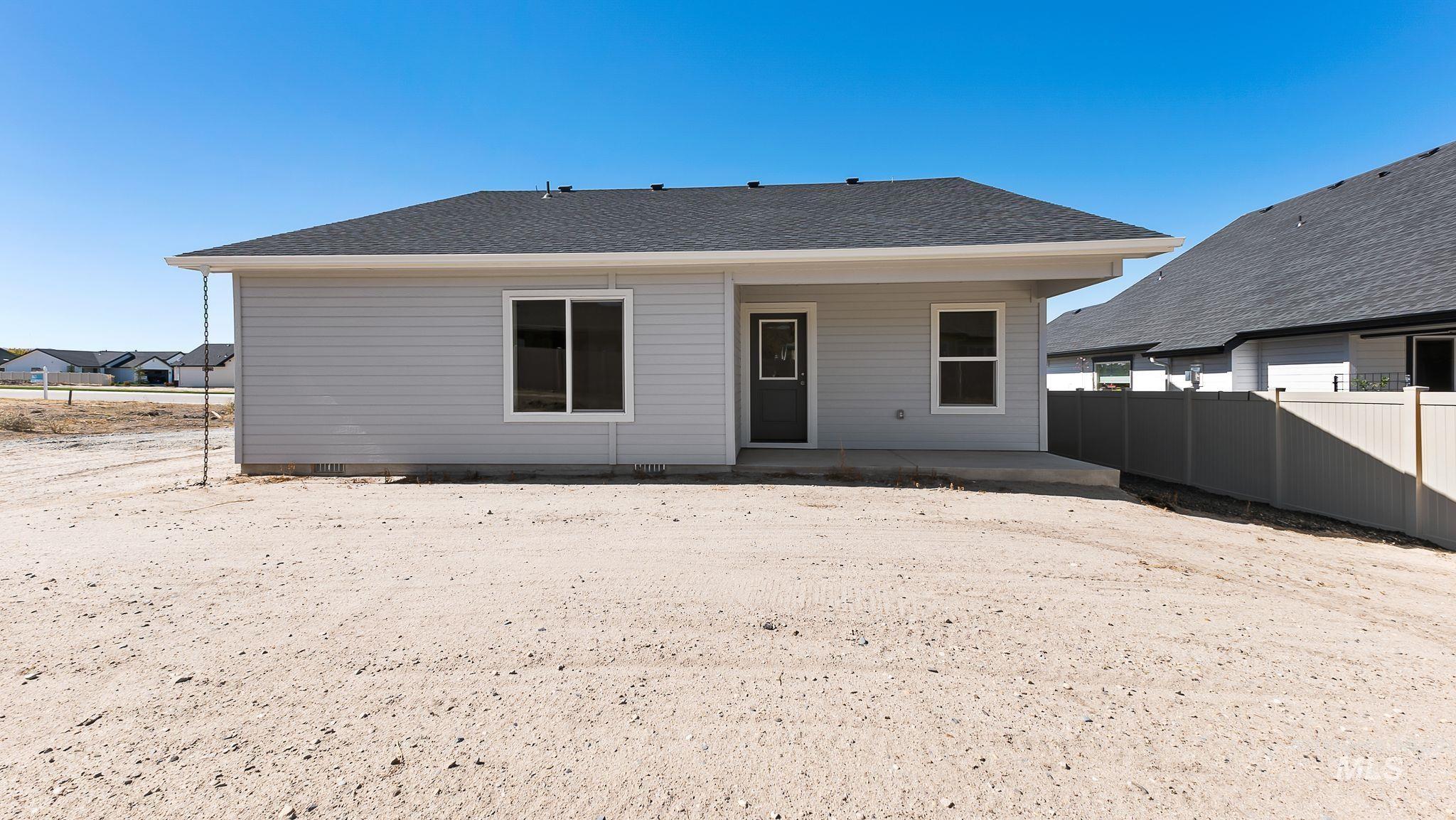 1440 Castle Way Emmett, ID 83617 - Photo 21 of 30 Rear view of property with a patio area and a shingled roof