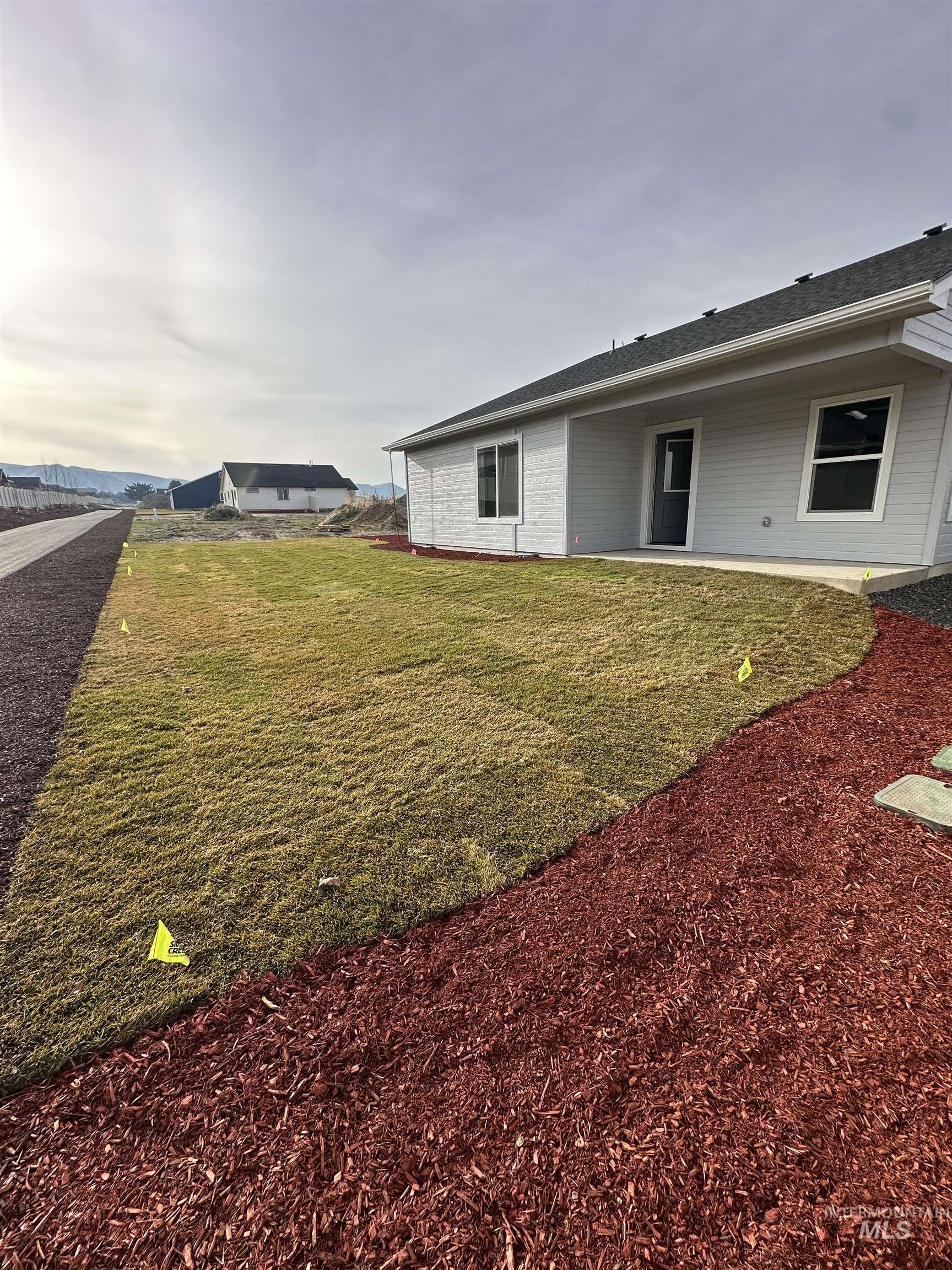 1440 Castle Way Emmett, ID 83617 - Photo 30 of 30 View of grassy yard with a patio area