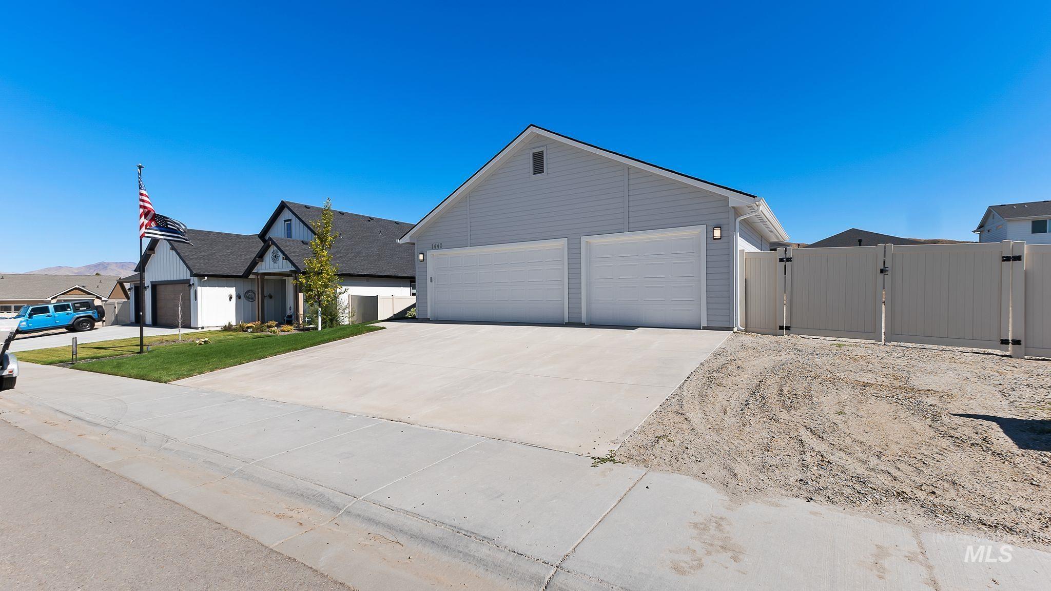 1440 Castle Way Emmett, ID 83617 - Photo 3 of 30 View of front of house with a gate, driveway, and an attached garage