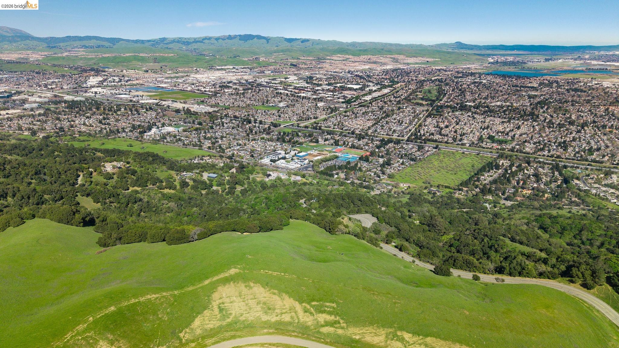 0 Santos Ranch Road Pleasanton, CA 94588 - Photo 4 of 18 a view of a lake with a city