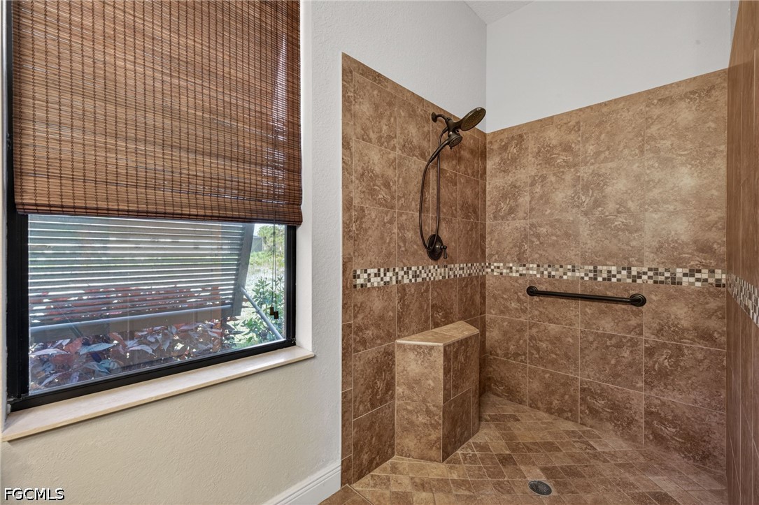 6109 Calusa Rdg Trail Bokeelia, FL 33922 - Photo 37 of 48 a bathroom with a shower