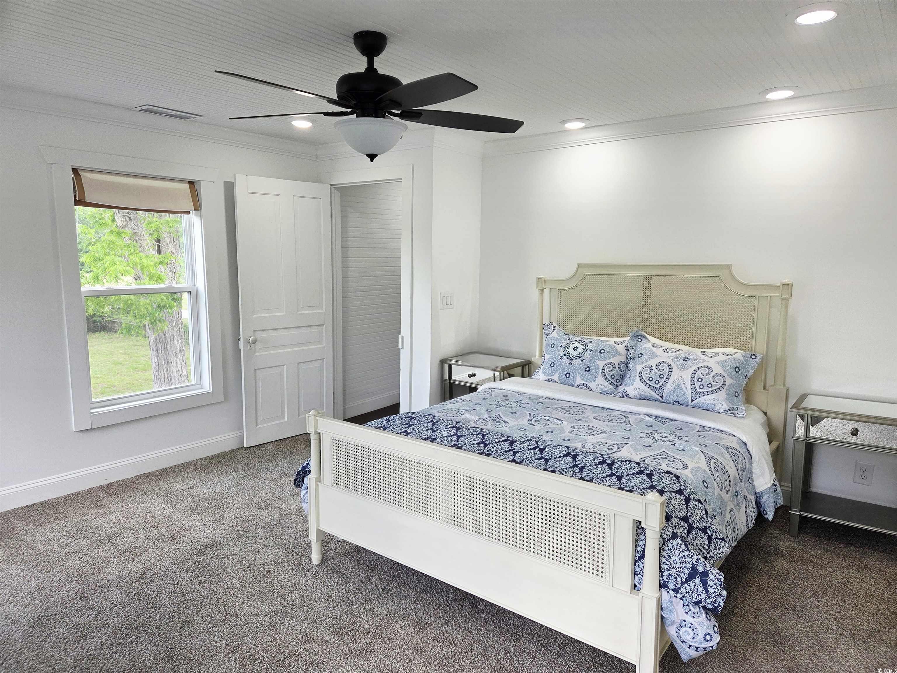 675 Liberty Church Road Loris, SC 29569 - Photo 29 of 35 Bedroom with crown molding, visible vents, baseboards, and carpet