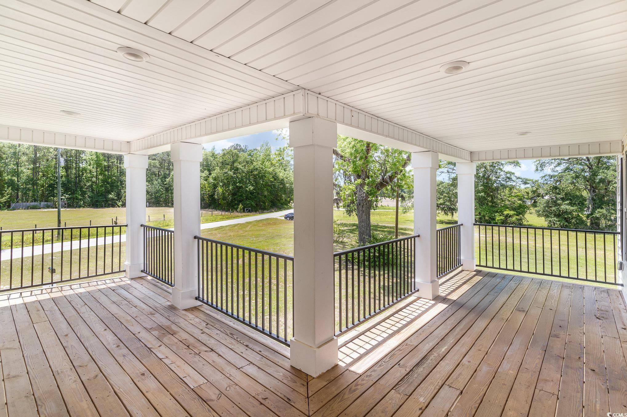 675 Liberty Church Road Loris, SC 29569 - Photo 8 of 35 Wooden terrace featuring a porch and a lawn