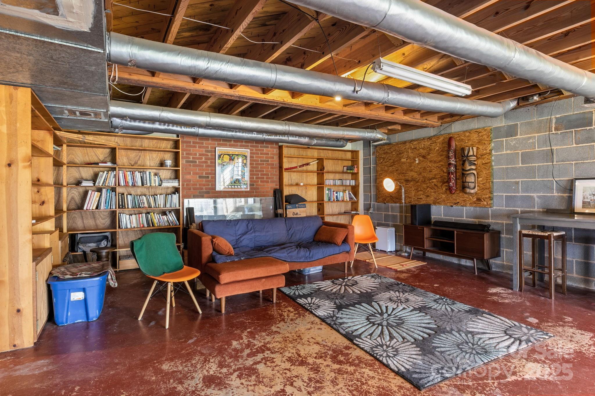 2988 Wesleyan Church Road Lincolnton, NC 28092 - Photo 17 of 24 a living room with furniture a fireplace and a table