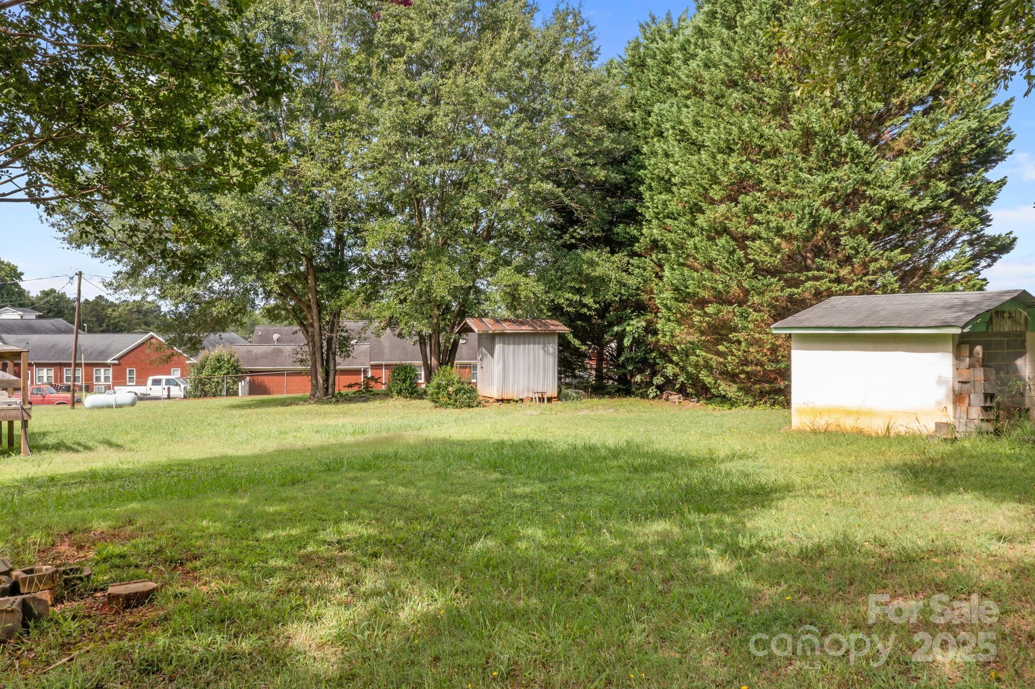 2988 Wesleyan Church Road Lincolnton, NC 28092 - Photo 22 of 24 a front view of a house with a yard and a garage