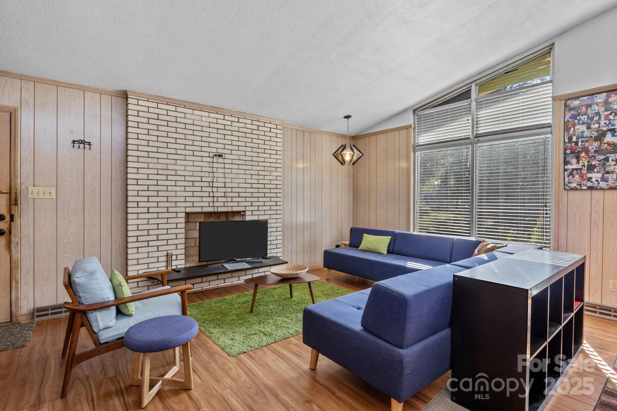 2988 Wesleyan Church Road Lincolnton, NC 28092 - Photo 3 of 24 a living room with furniture and a fireplace