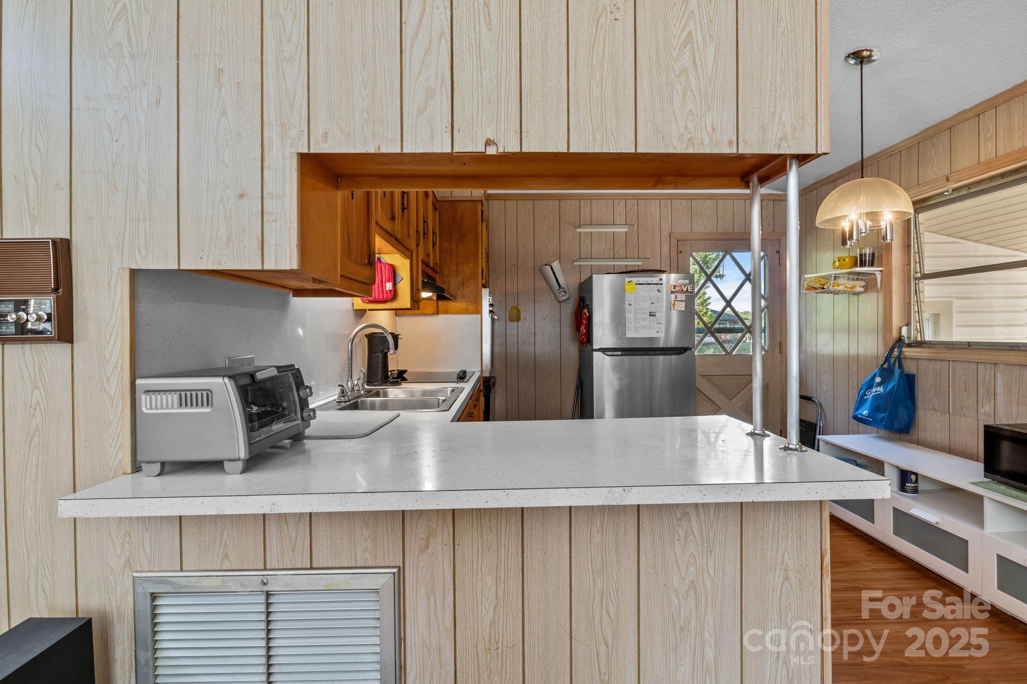 2988 Wesleyan Church Road Lincolnton, NC 28092 - Photo 4 of 24 a kitchen with stainless steel appliances a sink and cabinets