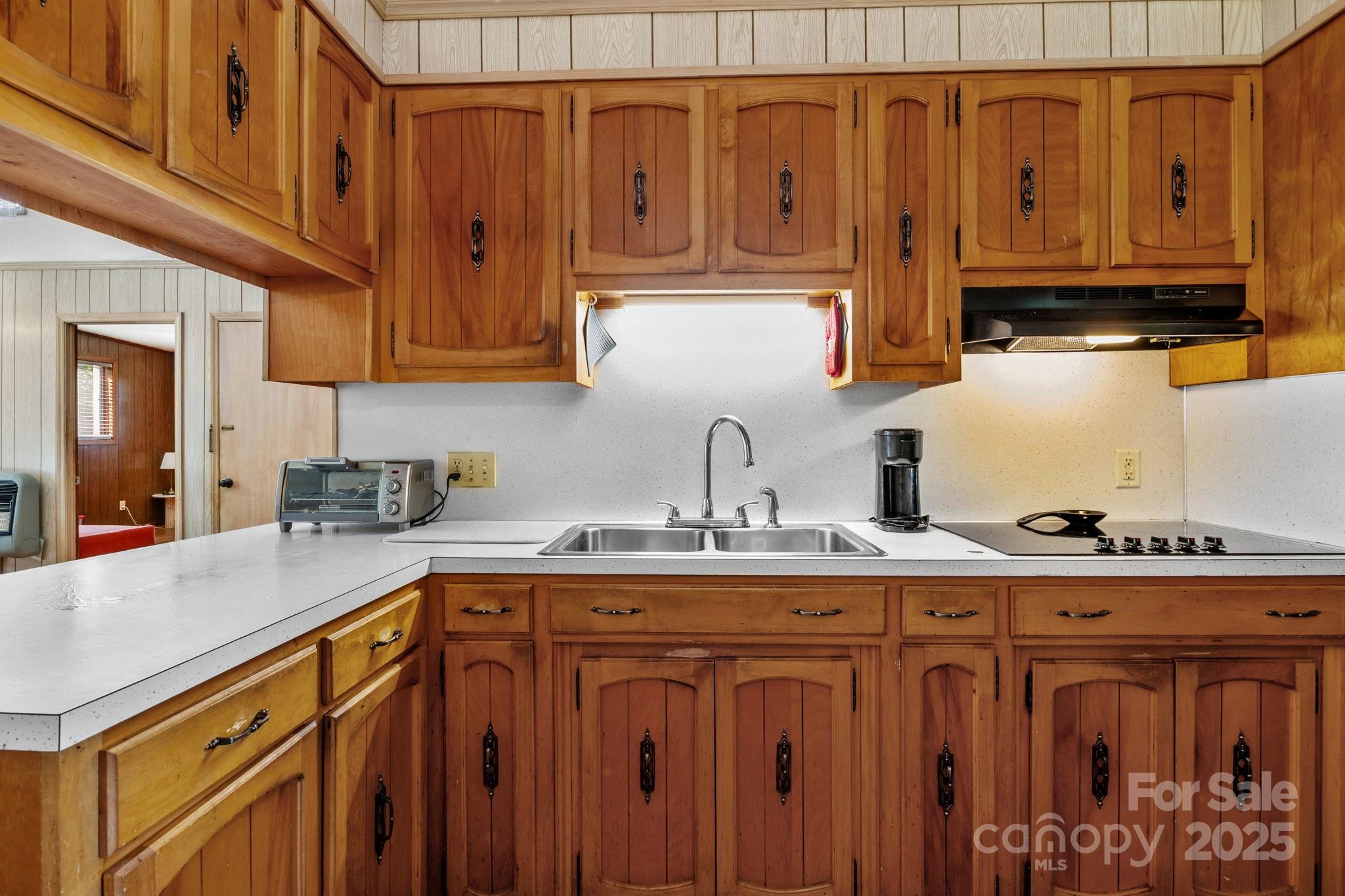 2988 Wesleyan Church Road Lincolnton, NC 28092 - Photo 6 of 24 a kitchen with stainless steel appliances granite countertop a sink a stove and cabinets