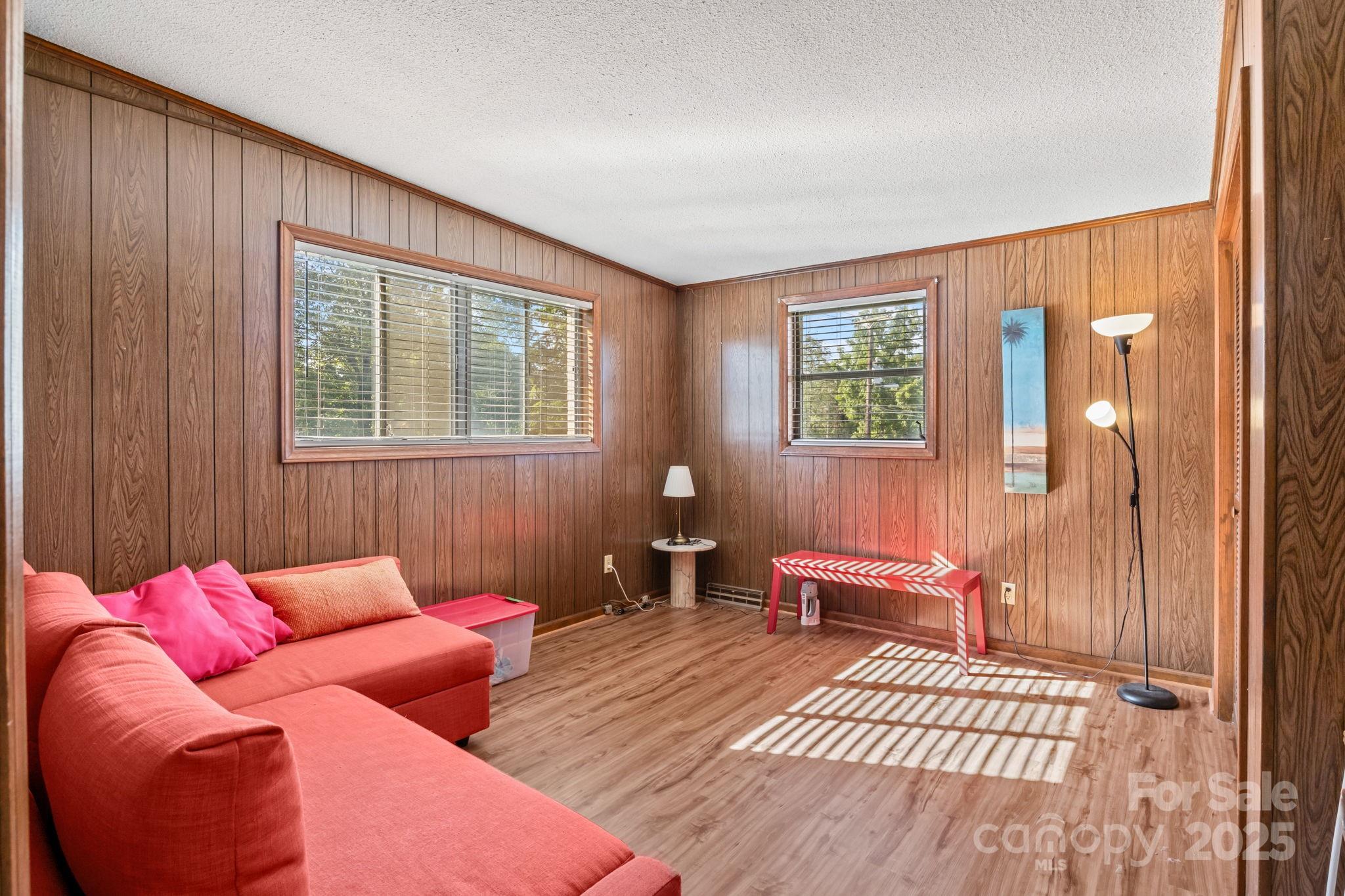 2988 Wesleyan Church Road Lincolnton, NC 28092 - Photo 9 of 24 a bedroom with furniture and wooden floor