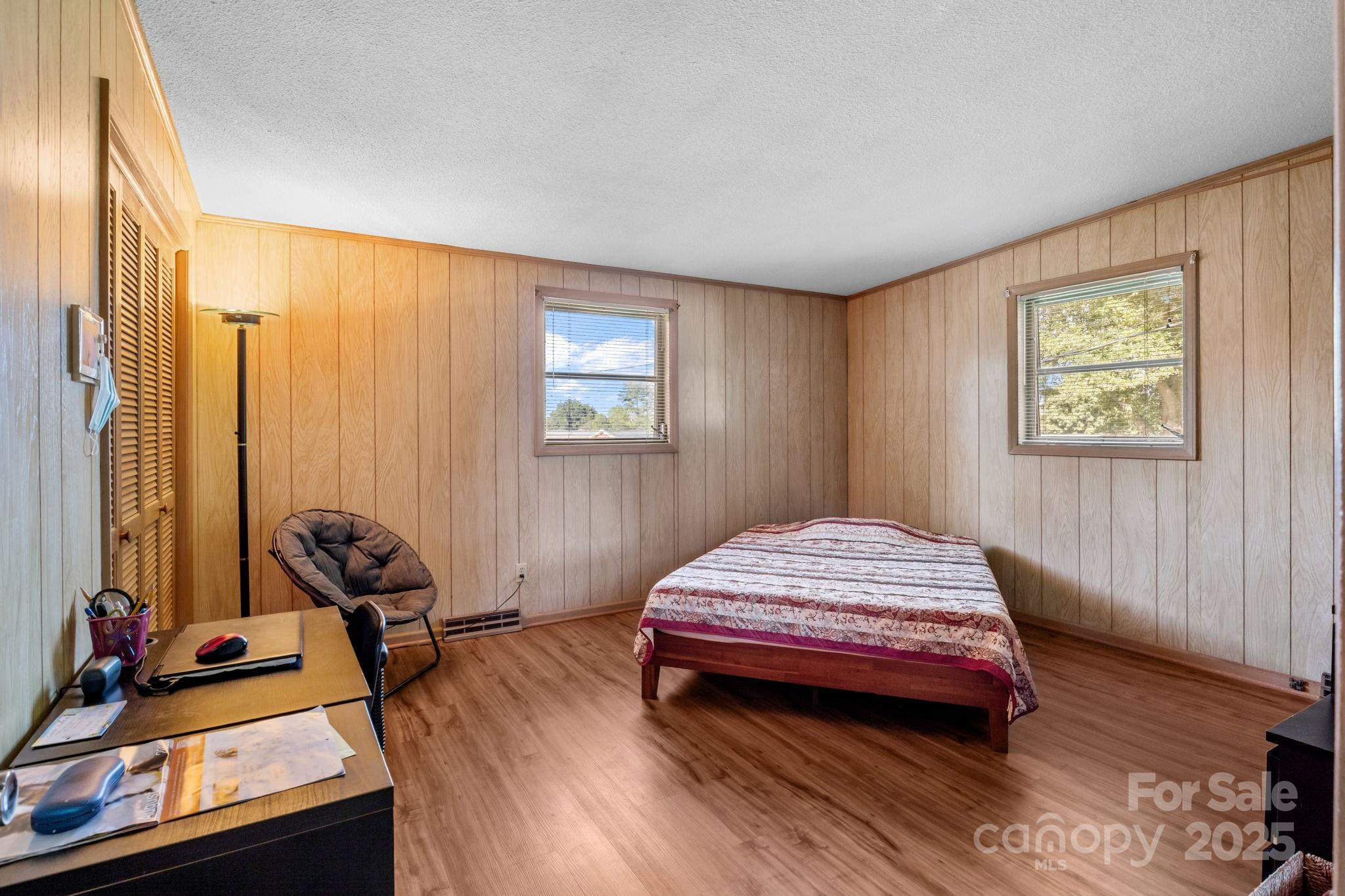 2988 Wesleyan Church Road Lincolnton, NC 28092 - Photo 10 of 24 a bedroom with a bed and wooden floor