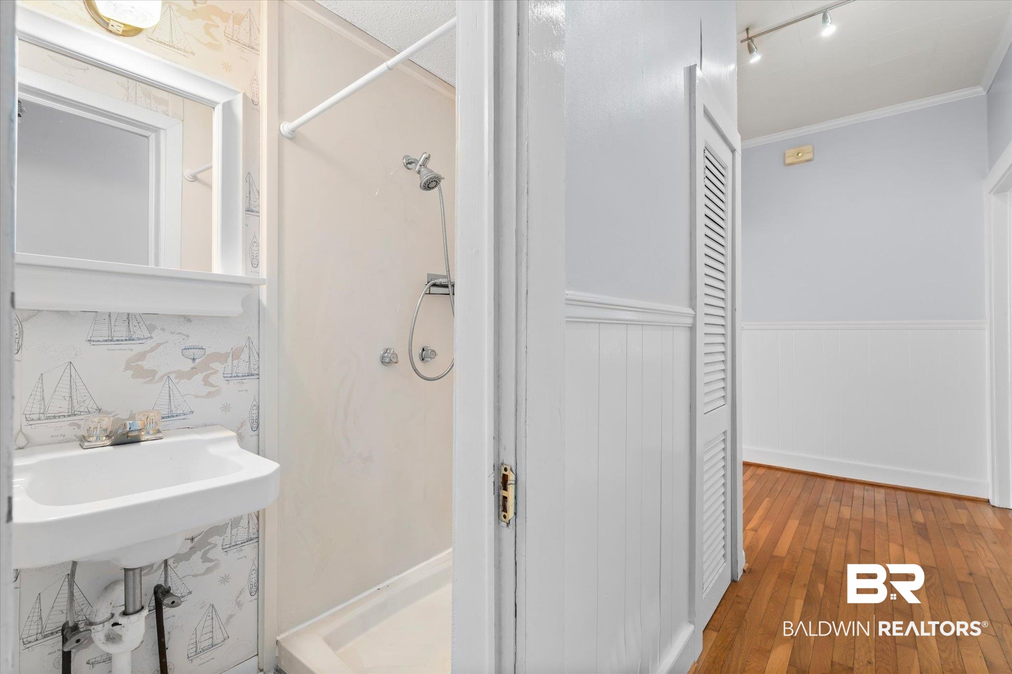 211 3rd Street Mobile, AL 36611 - Photo 14 of 20 Bathroom with a shower, crown molding, and hardwood / wood-style floors