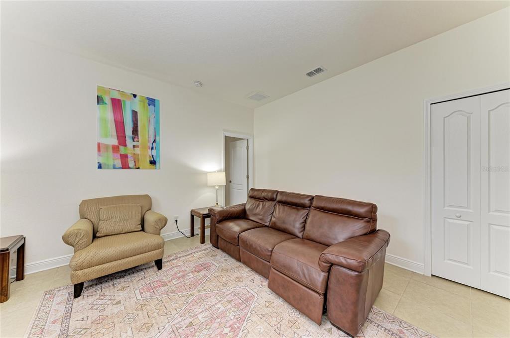 302 Cockle Shell Loop Apollo Beach, FL 33572 - Photo 45 of 75 a living room with furniture and a couch