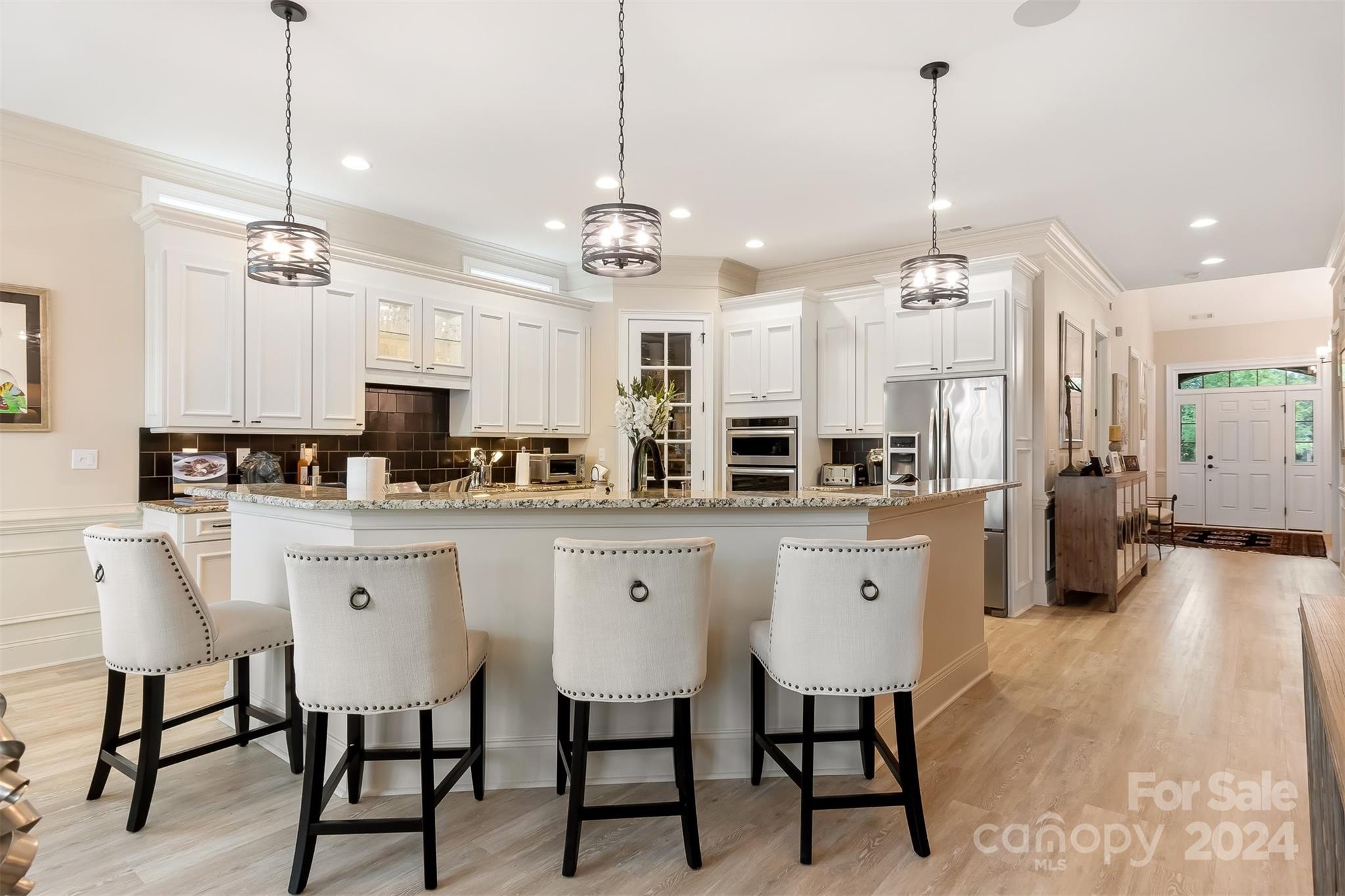 15608 Lake Ridge Road Charlotte, NC 28278 - Photo 12 of 37 a large kitchen with lots of counter space and stainless steel appliances