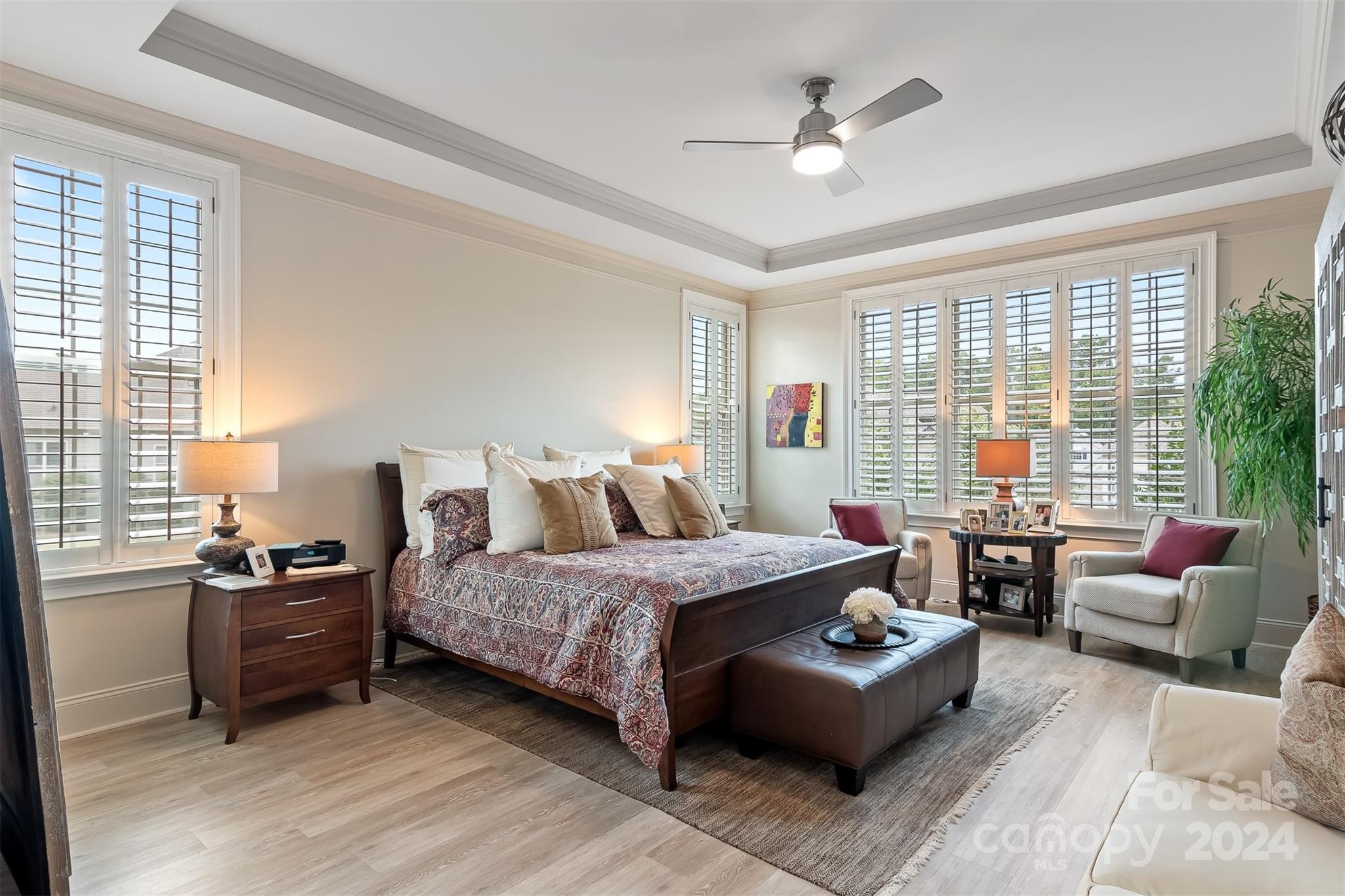 15608 Lake Ridge Road Charlotte, NC 28278 - Photo 15 of 37 a bedroom with a bed couch and windows