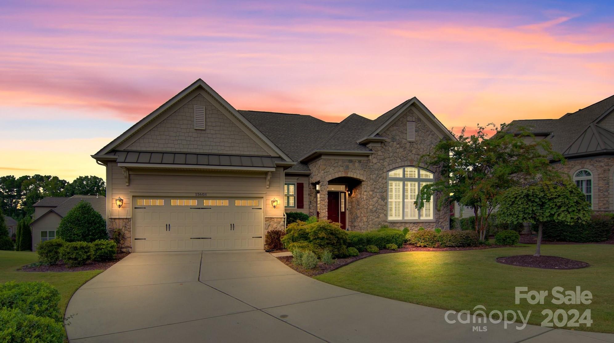 15608 Lake Ridge Road Charlotte, NC 28278 - Photo 2 of 37 a front view of a house with garden