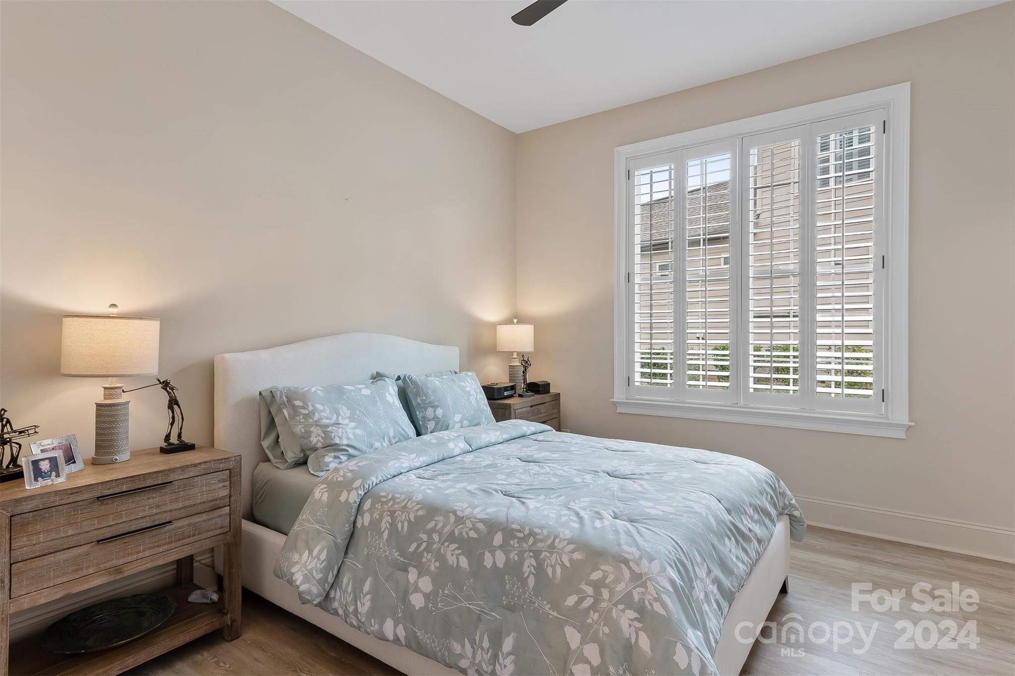 15608 Lake Ridge Road Charlotte, NC 28278 - Photo 21 of 37 a bedroom with a bed and a window