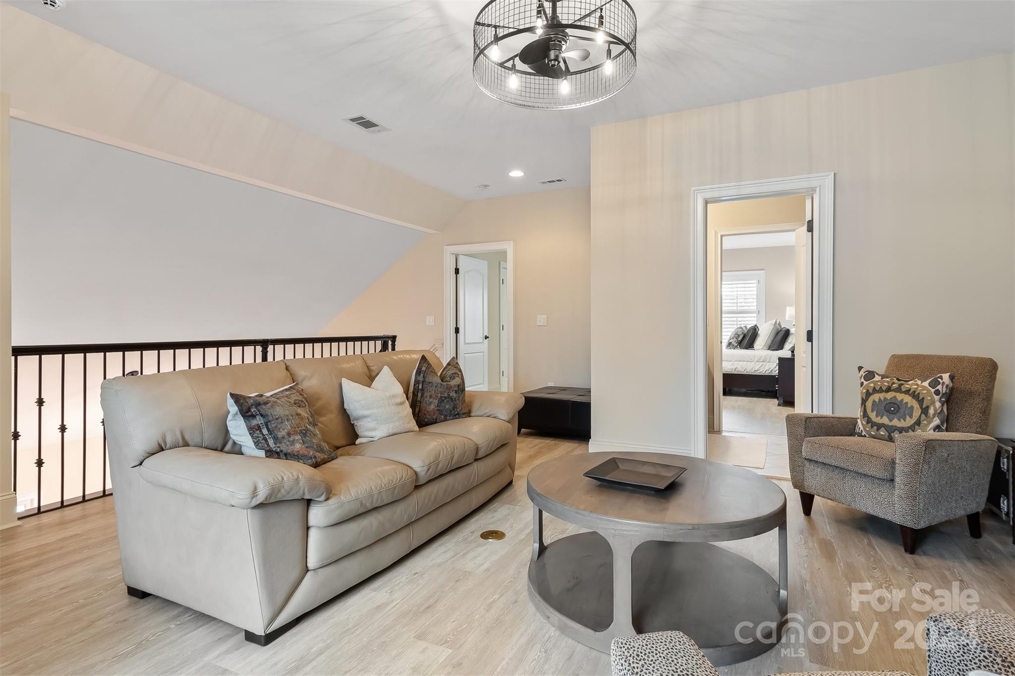15608 Lake Ridge Road Charlotte, NC 28278 - Photo 25 of 37 a living room with furniture and a wooden floor