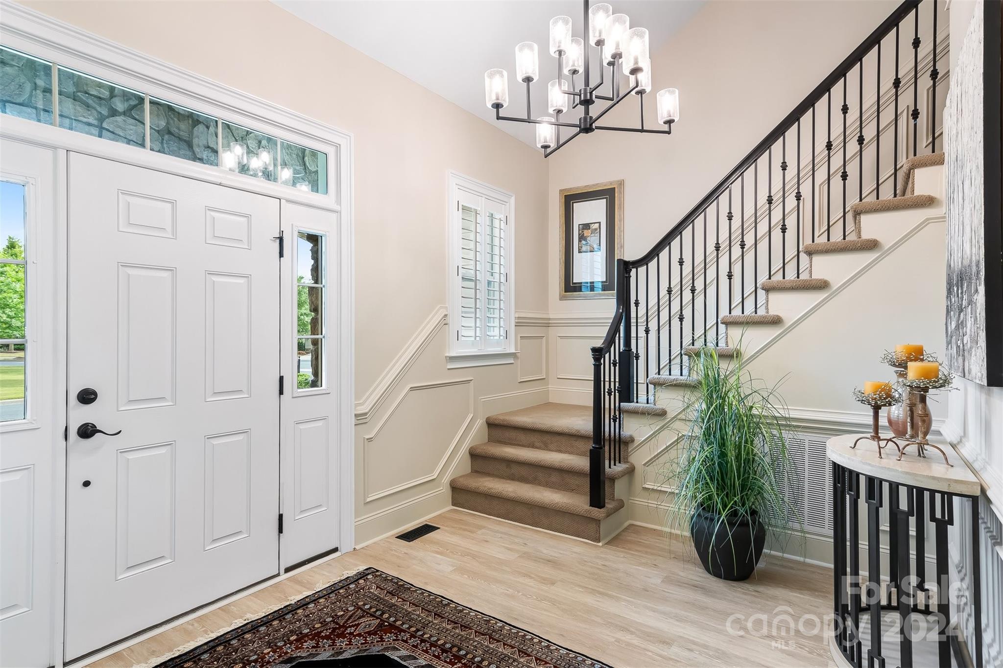 15608 Lake Ridge Road Charlotte, NC 28278 - Photo 3 of 37 a view of entryway with wooden floor and stairs