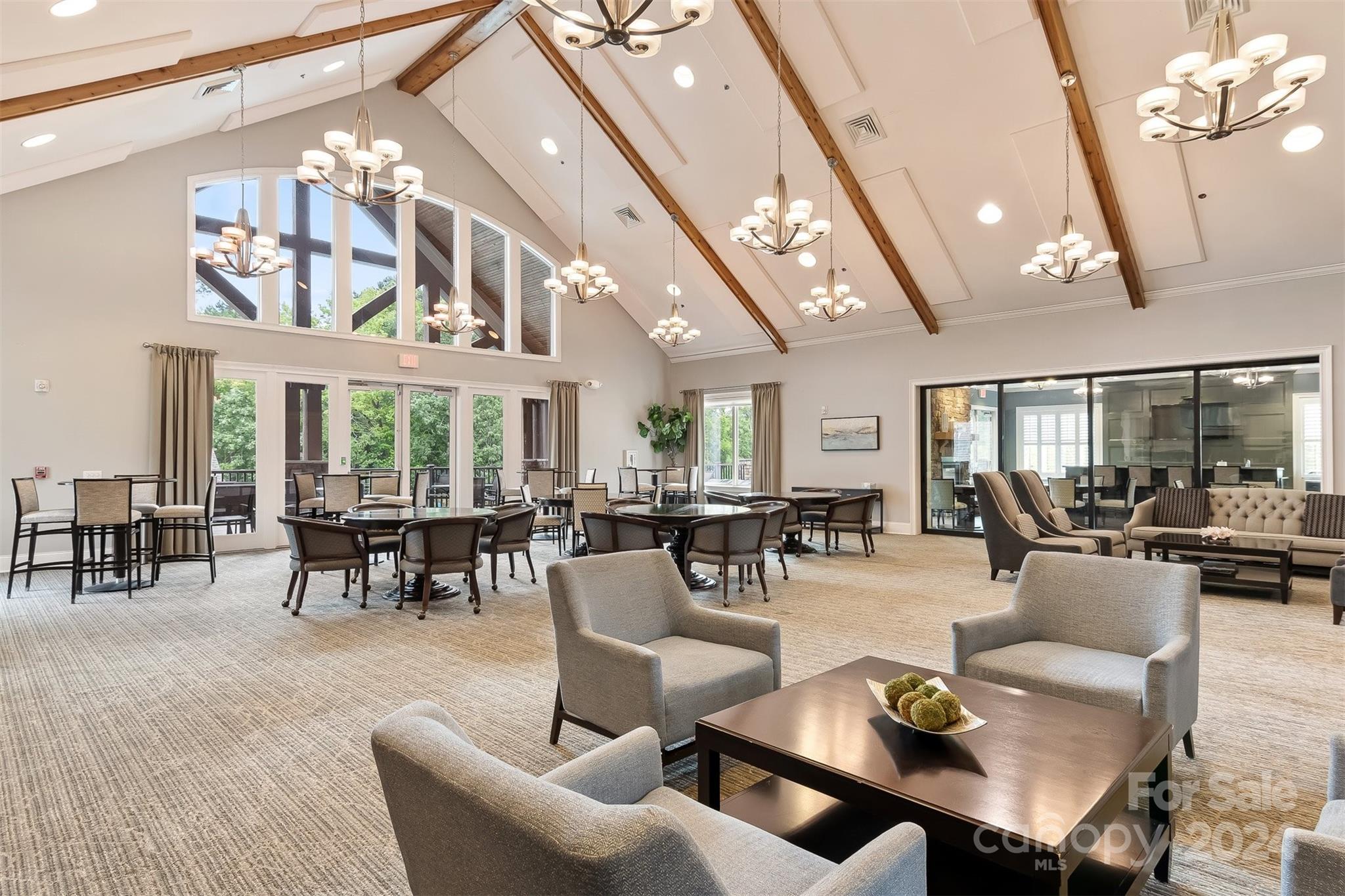 15608 Lake Ridge Road Charlotte, NC 28278 - Photo 34 of 37 a living room with furniture a chandelier and a large window
