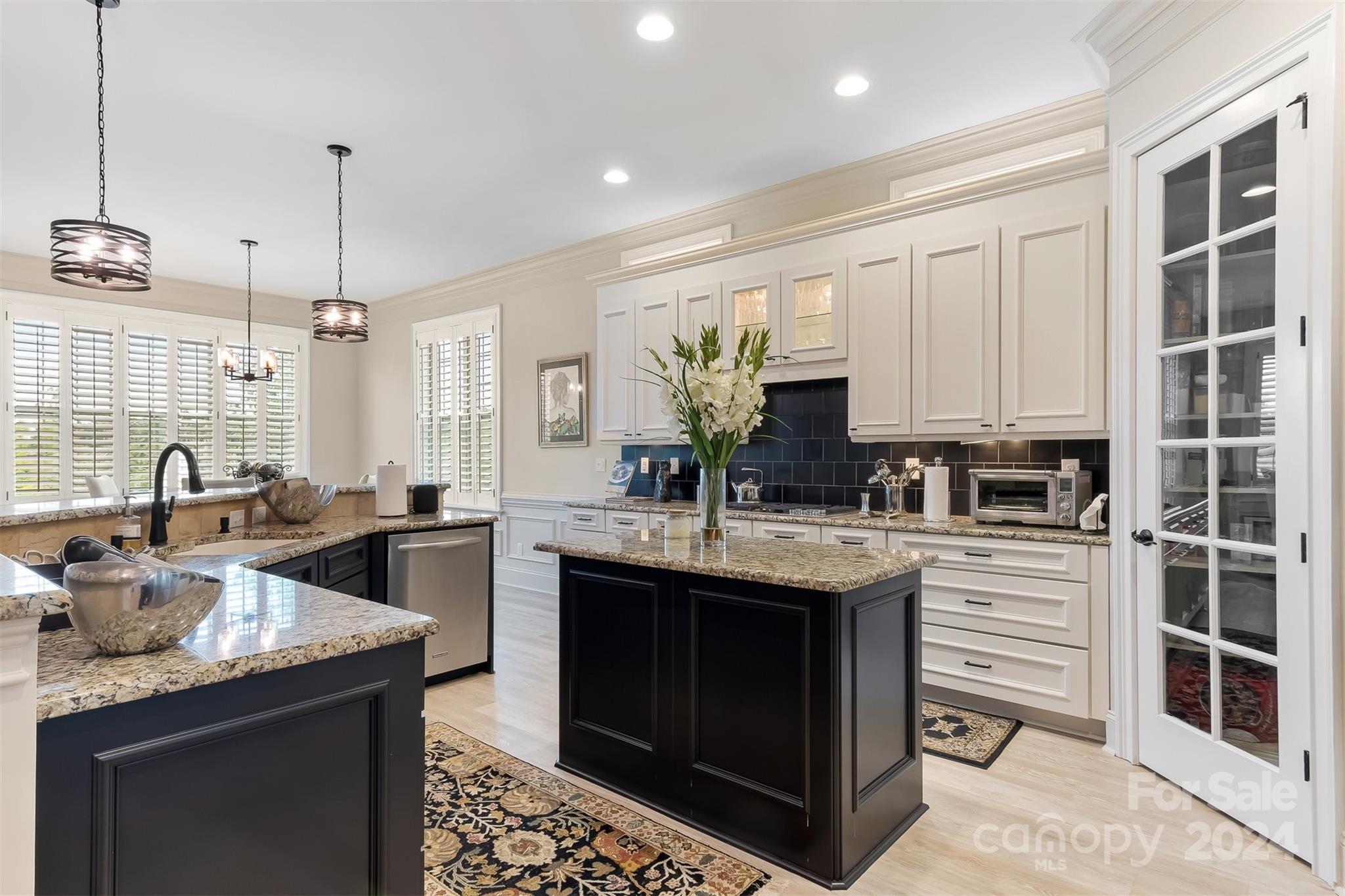 15608 Lake Ridge Road Charlotte, NC 28278 - Photo 9 of 37 a kitchen with a sink stove and cabinets