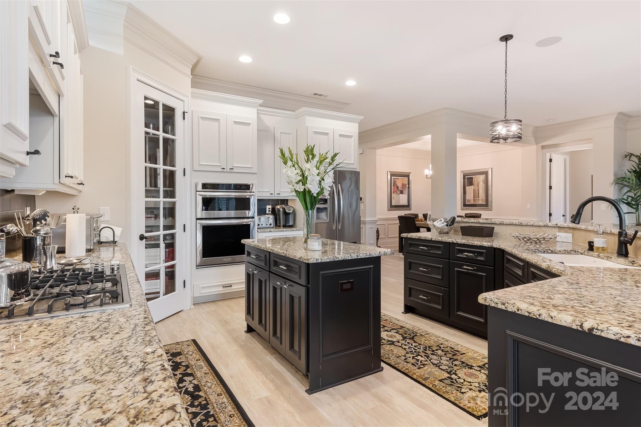 15608 Lake Ridge Road Charlotte, NC 28278 - Photo 10 of 37 a kitchen with stainless steel appliances granite countertop a stove and a sink