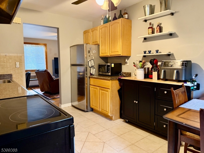 80 Troy Drive Springfield, NJ 07081 - Photo 2 of 11 a kitchen with a refrigerator and a stove