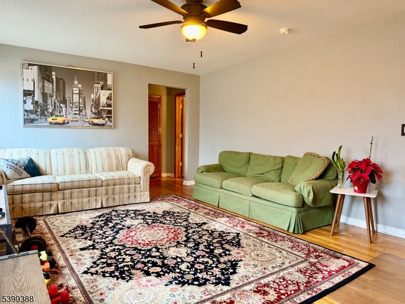 80 Troy Drive Springfield, NJ 07081 - Photo 4 of 11 a living room with furniture and a rug