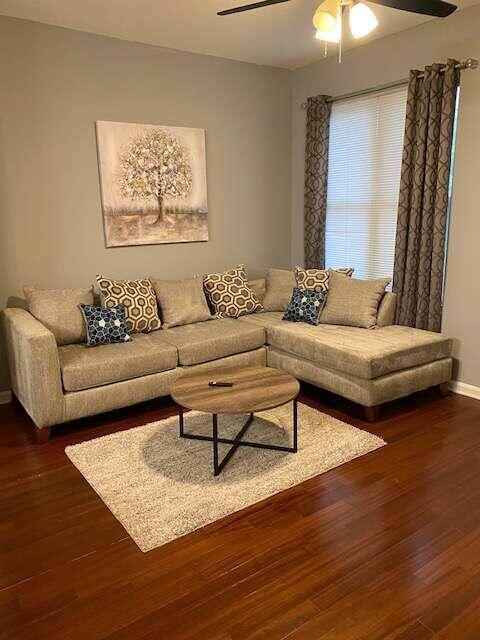 a living room with furniture and a rug