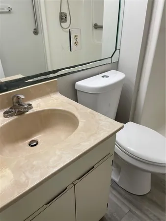 a bathroom with a sink and mirror