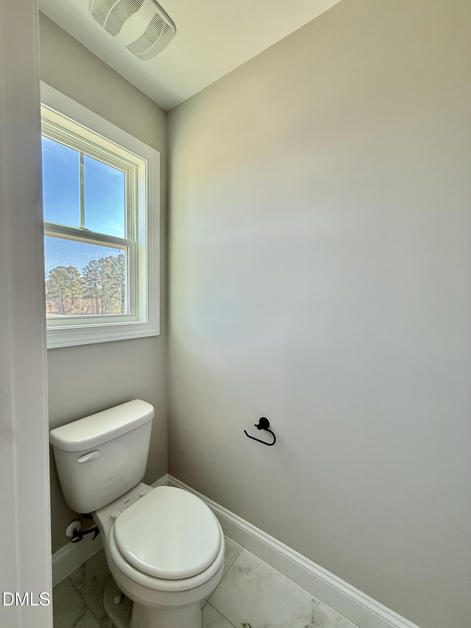 6862 Fire Tower Road Spring Hope, NC 27882 - Photo 19 of 35 a white toilet sitting next to a bathroom sink