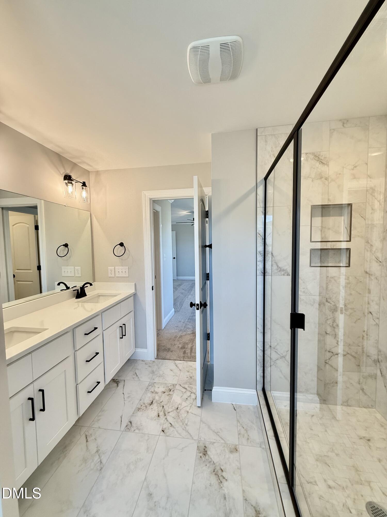 6862 Fire Tower Road Spring Hope, NC 27882 - Photo 21 of 35 a spacious bathroom with a shower sink and mirror