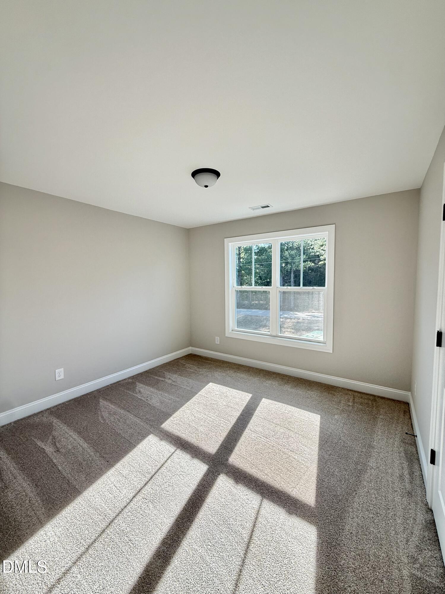 6862 Fire Tower Road Spring Hope, NC 27882 - Photo 29 of 35 a view of an empty room with a window
