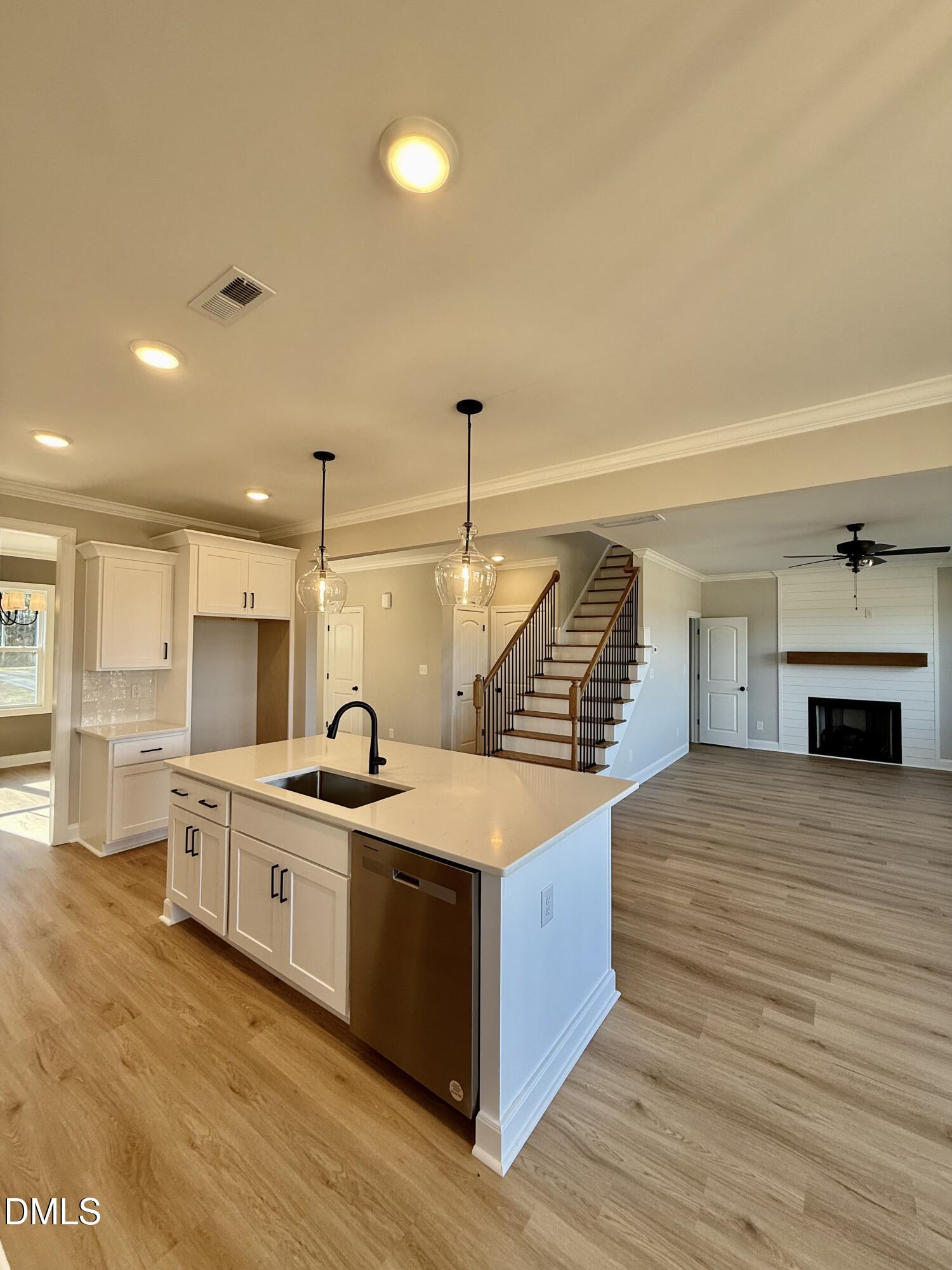 6862 Fire Tower Road Spring Hope, NC 27882 - Photo 6 of 35 a kitchen with stainless steel appliances granite countertop a sink and stove