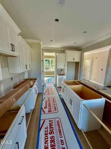 a large white room with a bed and a couch