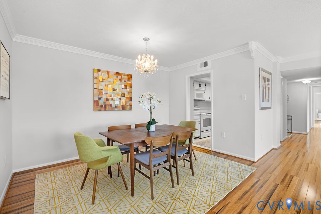2956 Hathaway Road, Unit U704 Richmond, VA 23225 - Photo 8 of 42 Dining area featuring wood-finish flooring, a crys