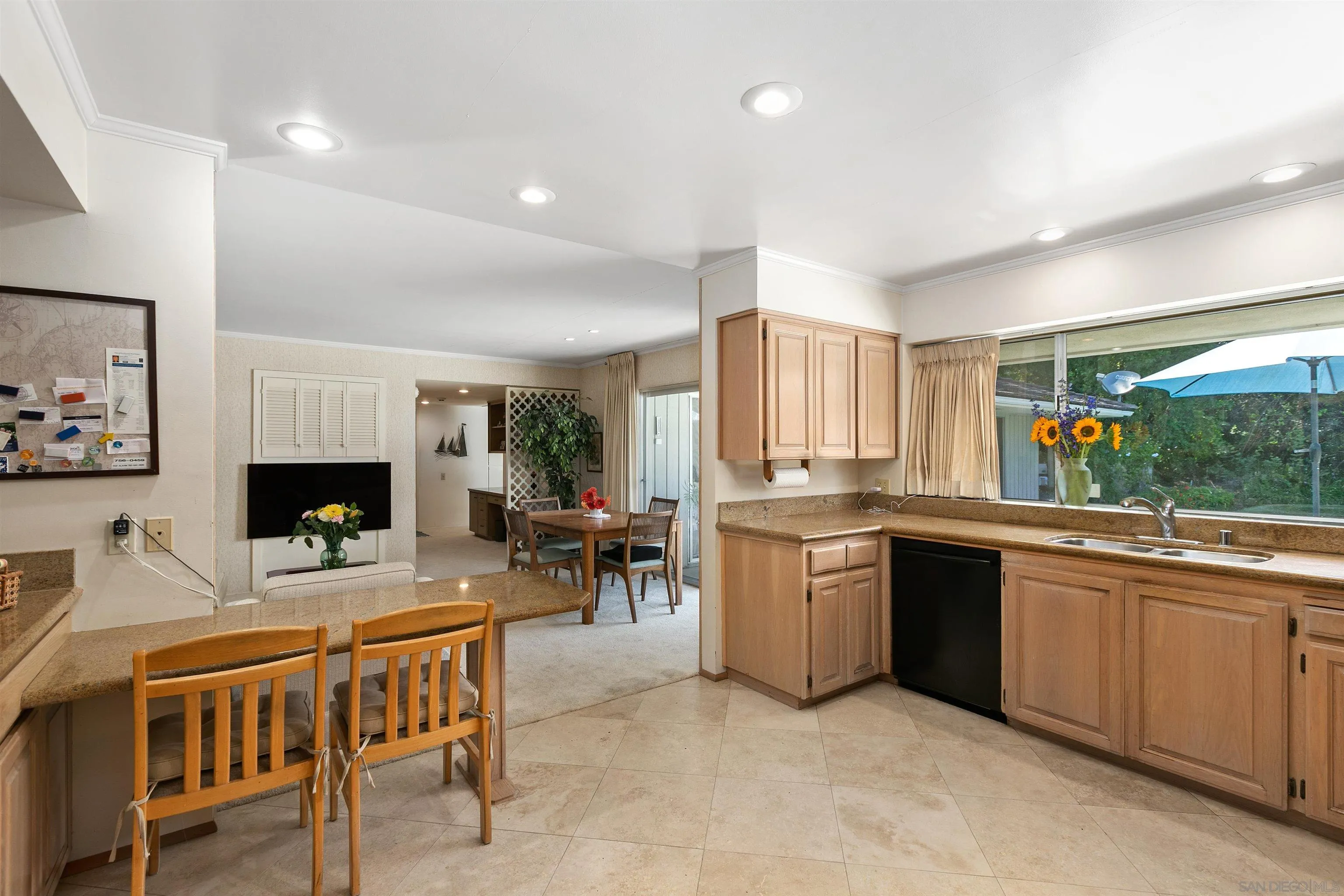 6350 Mimulus Rancho Santa Fe, CA 92067 - Photo 9 of 21 a kitchen with lots of counter top space and dining table