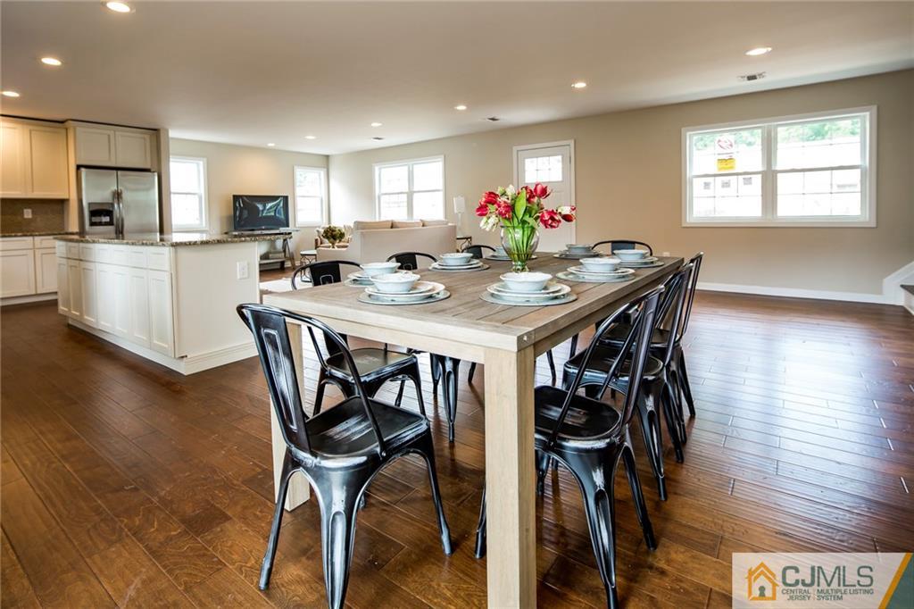 44 Caldwell Road Edison, NJ 08817 - Photo 16 of 25 a view of a dining room with furniture and wooden floor