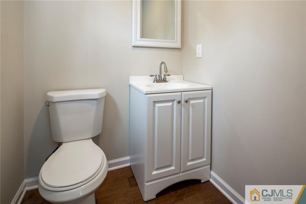 44 Caldwell Road Edison, NJ 08817 - Photo 17 of 25 a white toilet sitting next to a bathroom sink