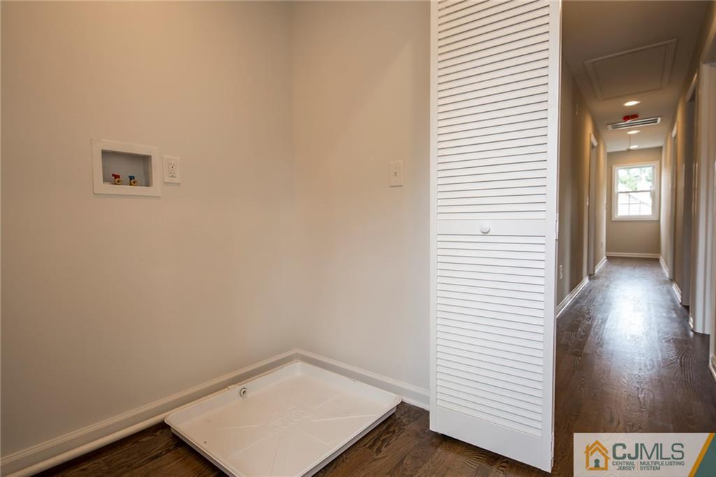 44 Caldwell Road Edison, NJ 08817 - Photo 21 of 25 an empty room with wooden floor and windows