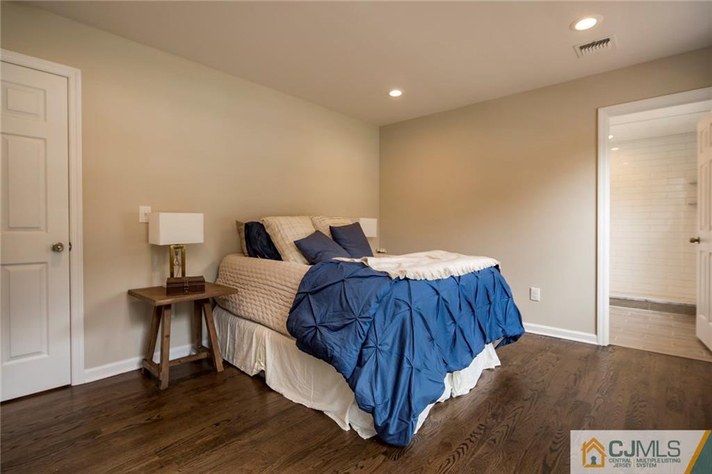 44 Caldwell Road Edison, NJ 08817 - Photo 22 of 25 a bedroom with a bed and wooden floor