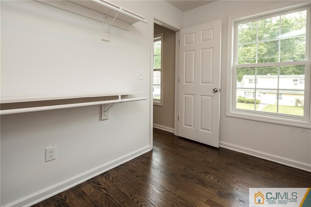 44 Caldwell Road Edison, NJ 08817 - Photo 24 of 25 a view of an empty room with wooden floor and a window