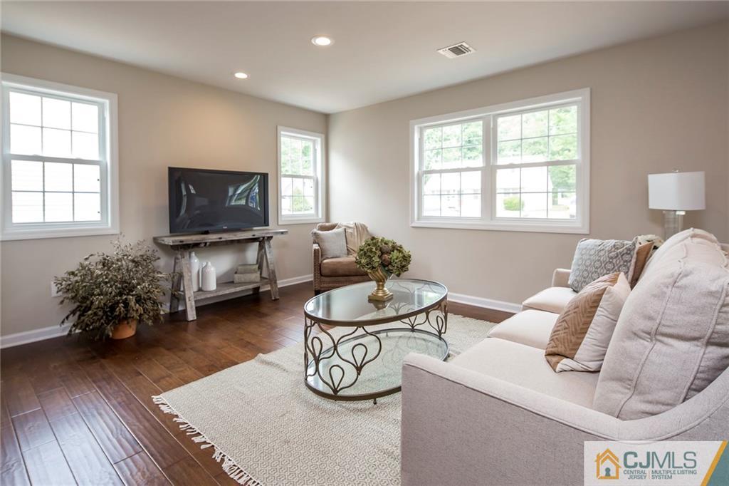 44 Caldwell Road Edison, NJ 08817 - Photo 6 of 25 a living room with furniture and a flat screen tv