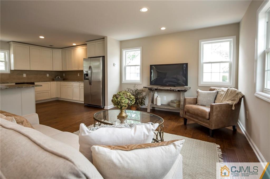 44 Caldwell Road Edison, NJ 08817 - Photo 7 of 25 a living room with furniture and a flat screen tv