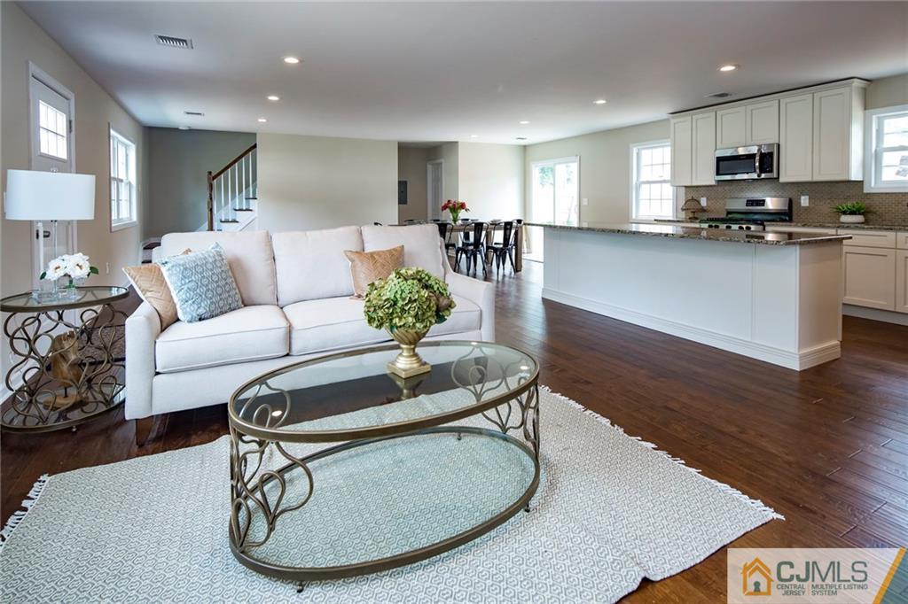 44 Caldwell Road Edison, NJ 08817 - Photo 9 of 25 a living room with furniture and kitchen view