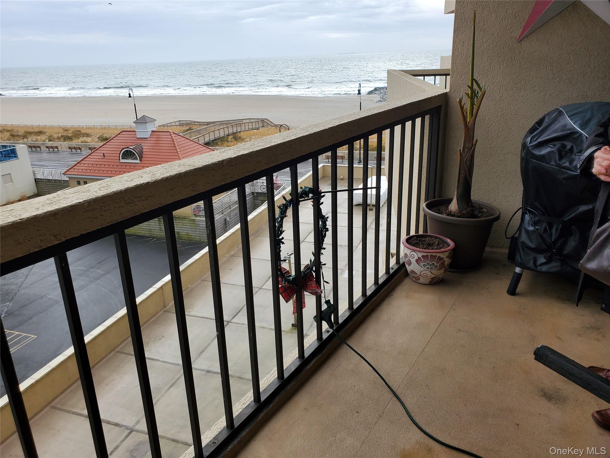 360 Shore Road, Unit 5A Long Beach, NY 11561 - Photo 3 of 16 a view of a balcony with an ocean