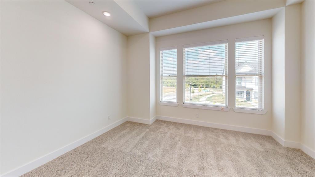 373 Buck Ridge Drive Frisco, TX 75068 - Photo 11 of 24 Carpeted flooring, recessed lighting, three large windows with blinds, and neutral wall tones