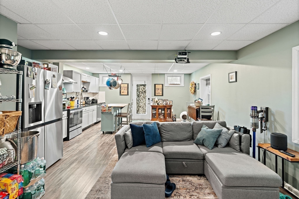 46-48 Walnut Street Peabody, MA 01960 - Photo 14 of 25 a living room with furniture and a flat screen tv