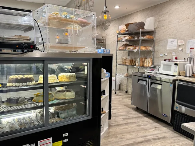 a kitchen with stainless steel appliances granite countertop a stove and a refrigerator