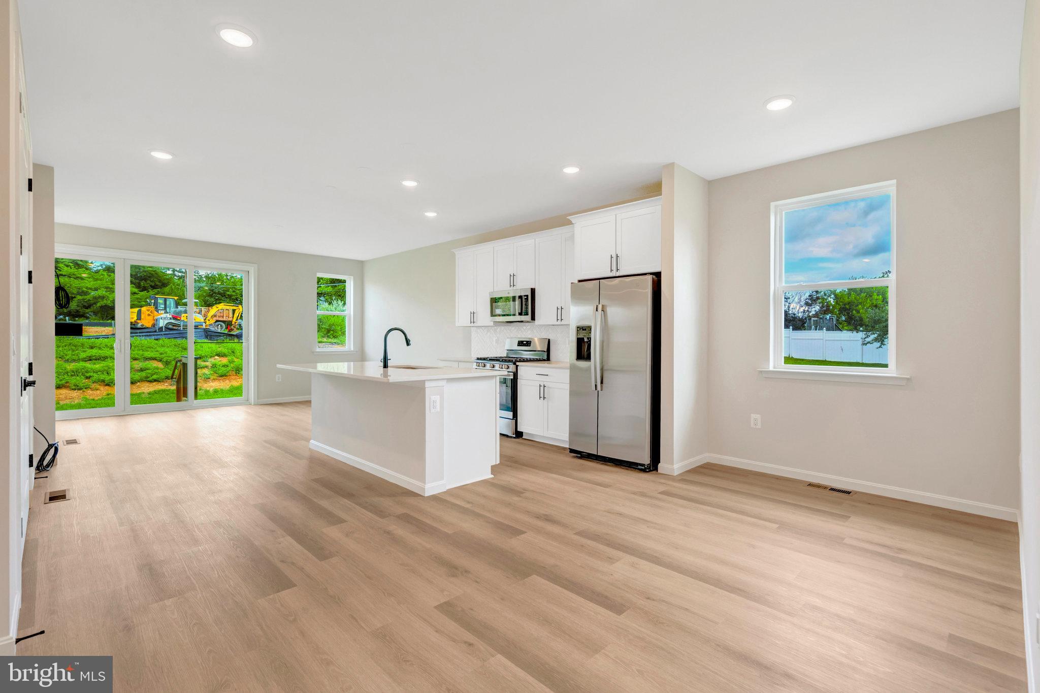 100 Midsummer Lane Middletown, VA 22645 - Photo 12 of 47 a view of a kitchen with a sink and a large window